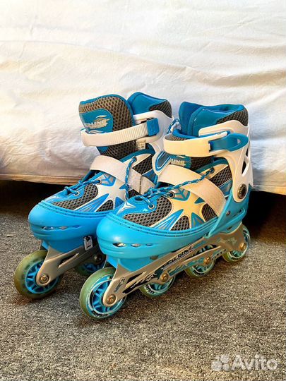 Роликовые коньки