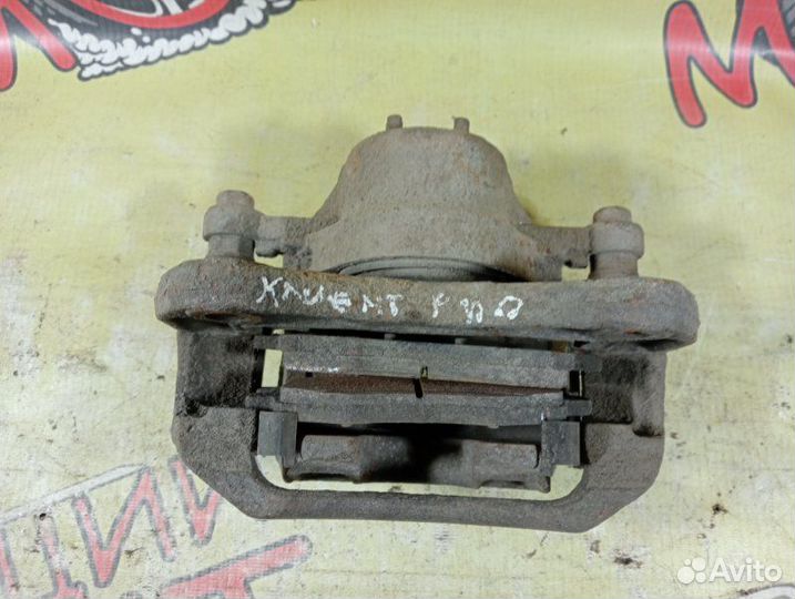 Суппорт тормозной передний левый Kia Rio 2 2010