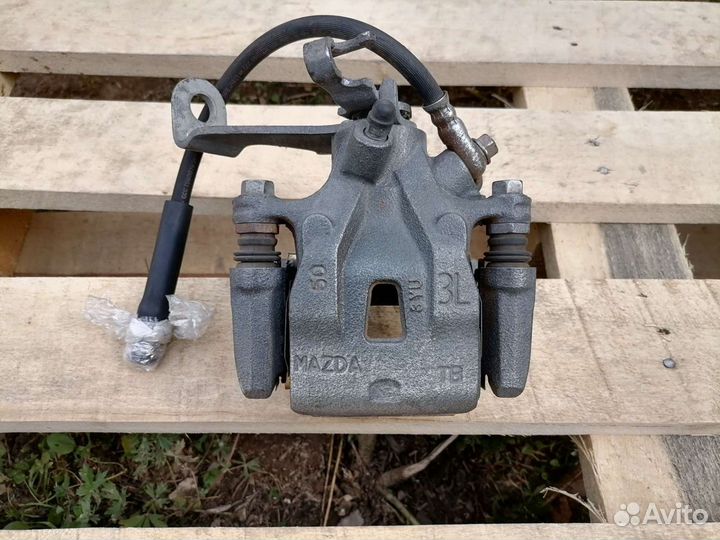 Задний левый тормозной суппорт мазда CX-5