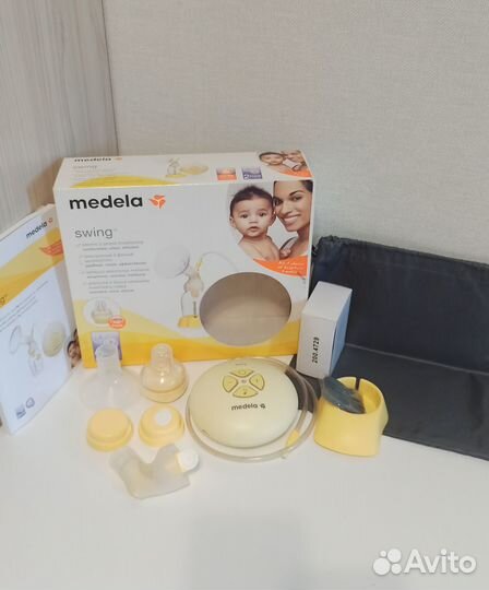 Молокоотсос medela swing + подушка для кормления