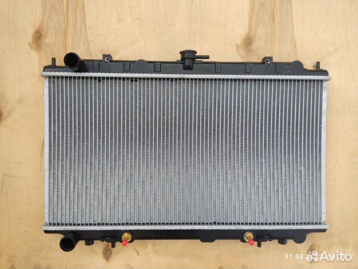 Радиатор охлаждения двигателя Nissan Bluebird U14