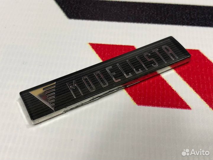 Эмблема Modellista Серая