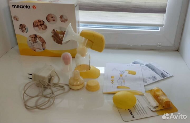 Молокоотсос medela электрический