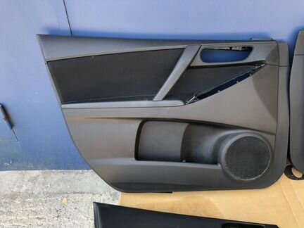 Обшивка двери Mazda 3 BL