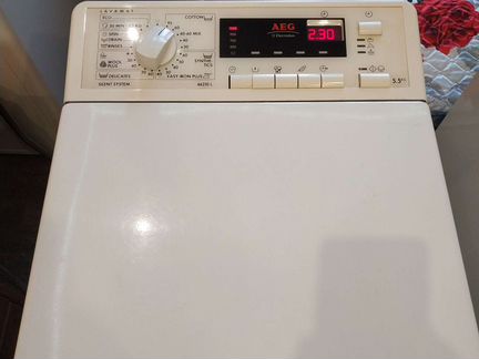 AEG с вертикальной загрузкой 5.5 кг 1200 об